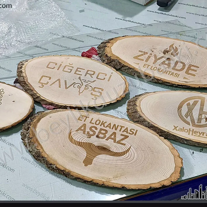 Ahşap üzerine baskı, logo baskı, yakma şeklinde baskı, kazıma şeklinde baskı, ürünü müşteri getirir, lazer baskı maliyetidir, kütük üzerine logo baskı